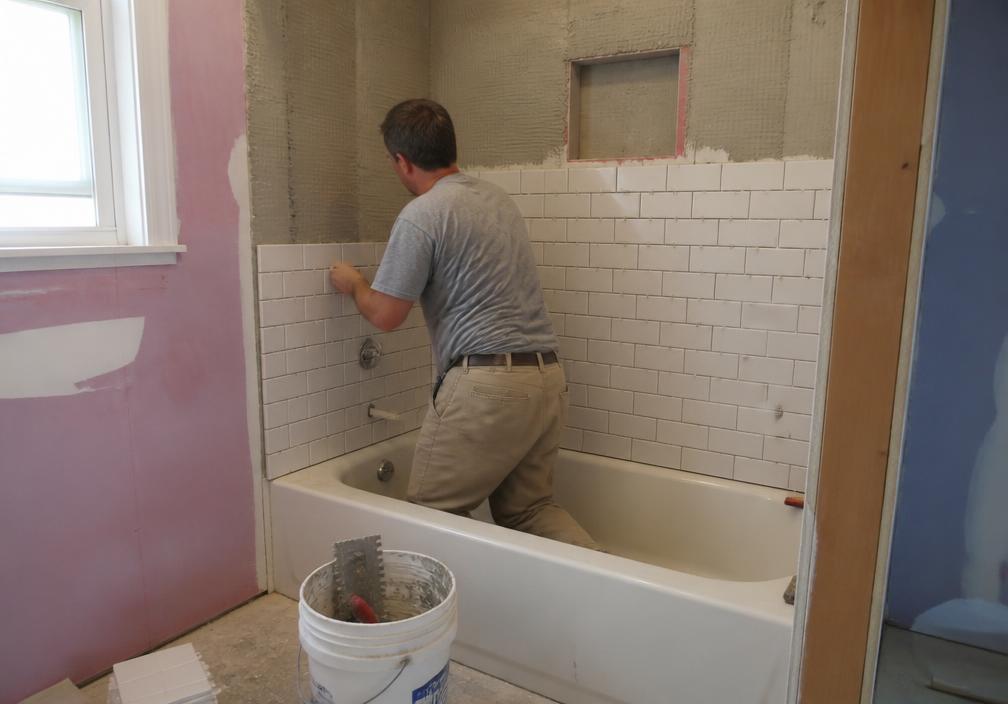Newly remodeled bathroom with tiled shower and modern vanity
